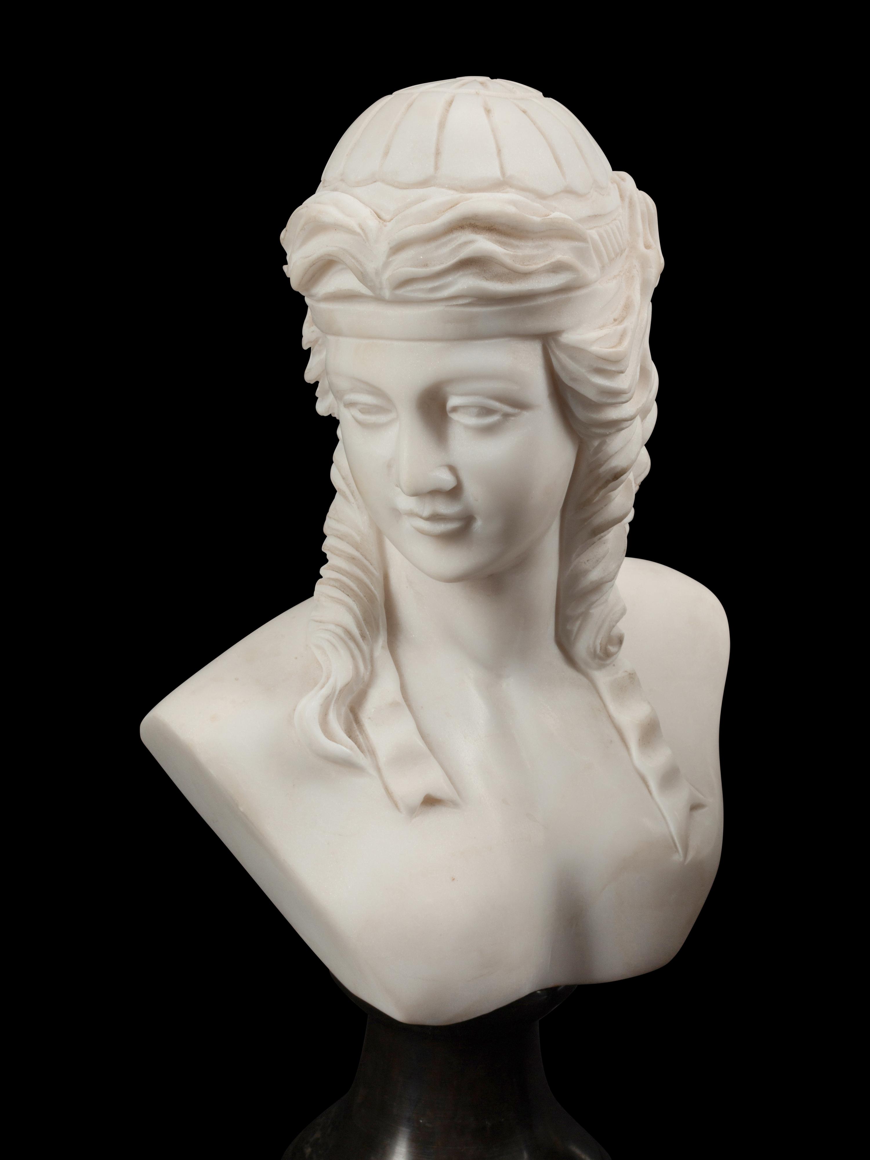 A Set of Four Bi-Color Marble Busts