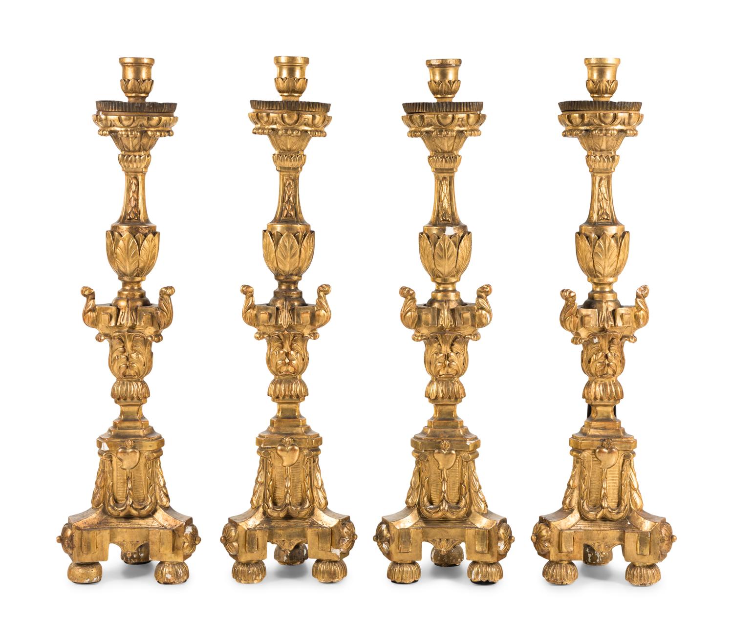 A Set of Four Continental Baroque Style Carved Giltwood Torchères