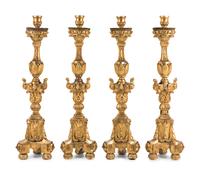 A Set of Four Continental Baroque Style Carved Giltwood Torchères