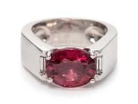 An 18 Karat White Gold, Red-Orange Sapphire and Diamond Ring, Cartier, Circa 1999,