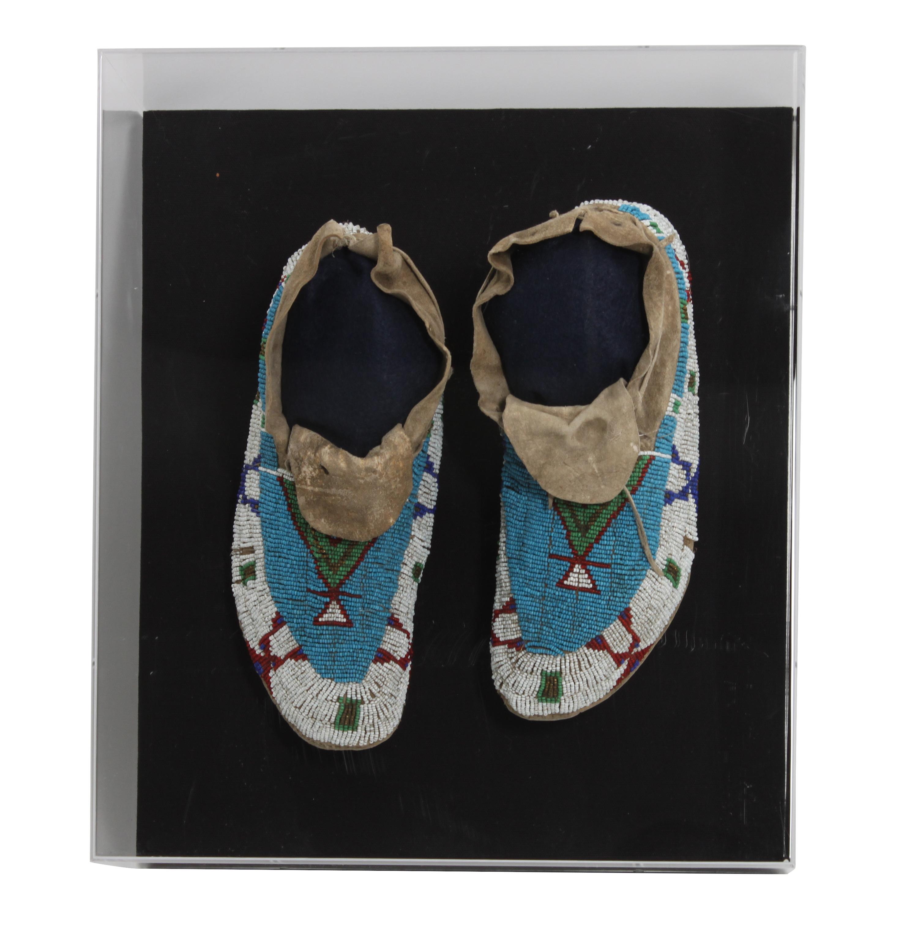 A Pair of Sioux Mocassins Length 10 inches — CIRCA 1910