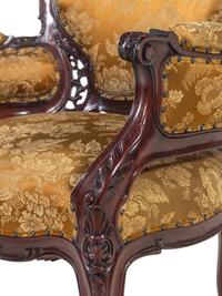 A Set of Four Rococo Style Upholstered Mahogany Armchairs