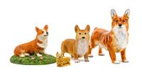 A Group of Four Pembroke Welsh Corgi Figures Width of widest 5 3/4 inches.
