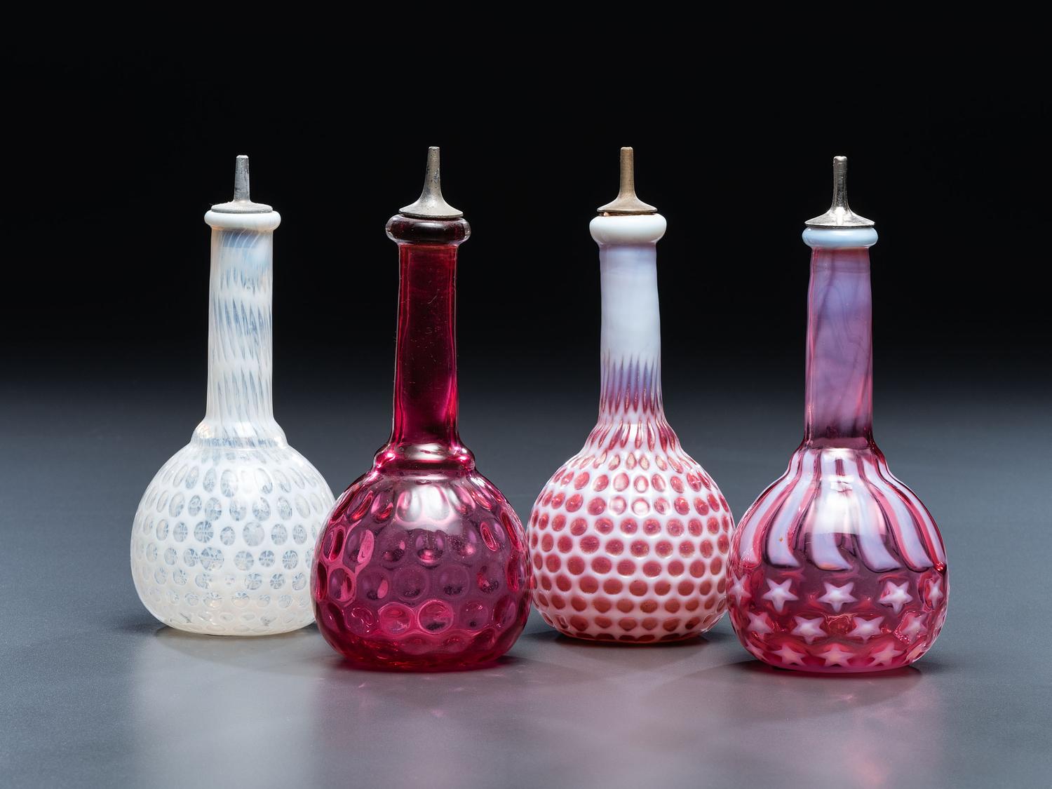 Four Glass Barber Bottles