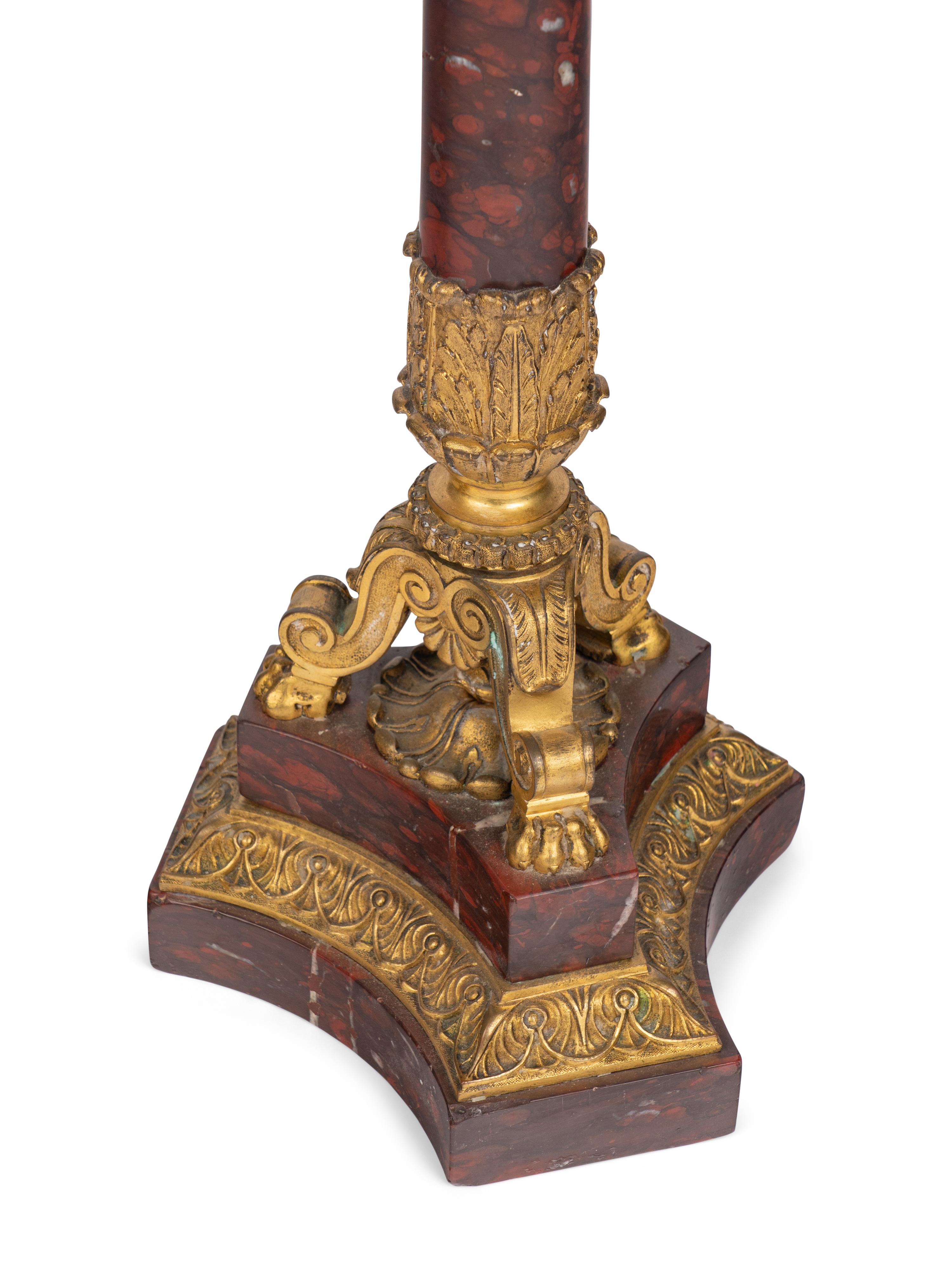 A Pair of Regency Gilt Bronze and Red Marble Five-Light Candelabra