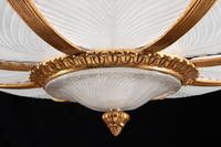 An Art Nouveau Style Gilt-Bronze and Frosted Glass Eight-Light Chandelier