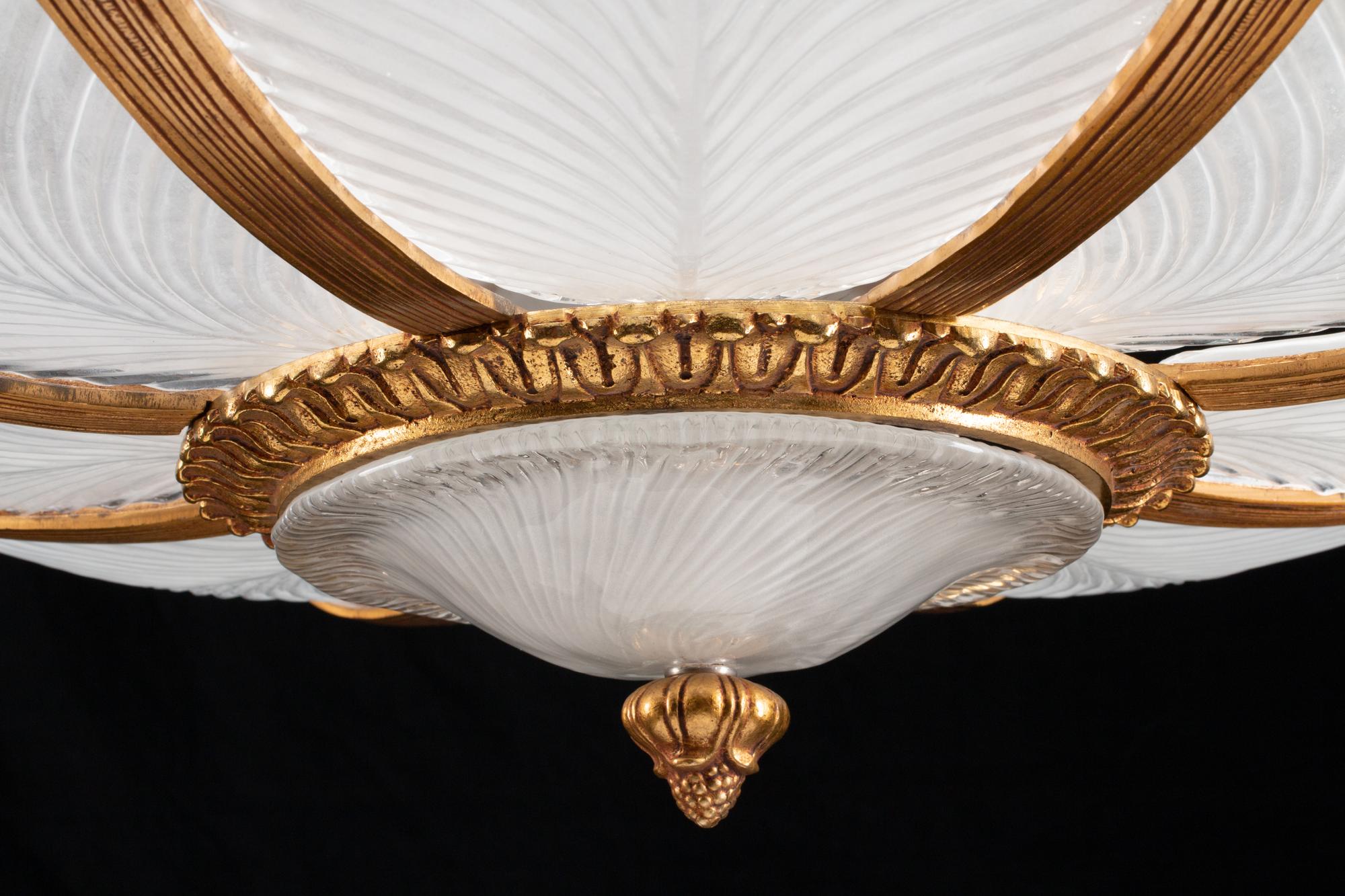 An Art Nouveau Style Gilt-Bronze and Frosted Glass Eight-Light Chandelier