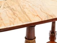 A Northern European Neoclassical Parcel Gilt Mahogany Center Table