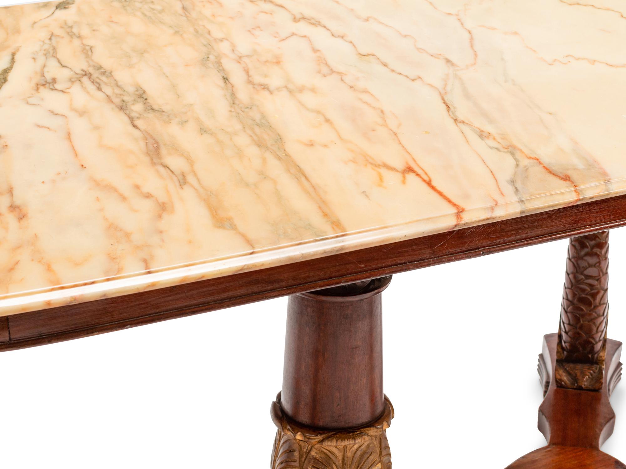 A Northern European Neoclassical Parcel Gilt Mahogany Center Table