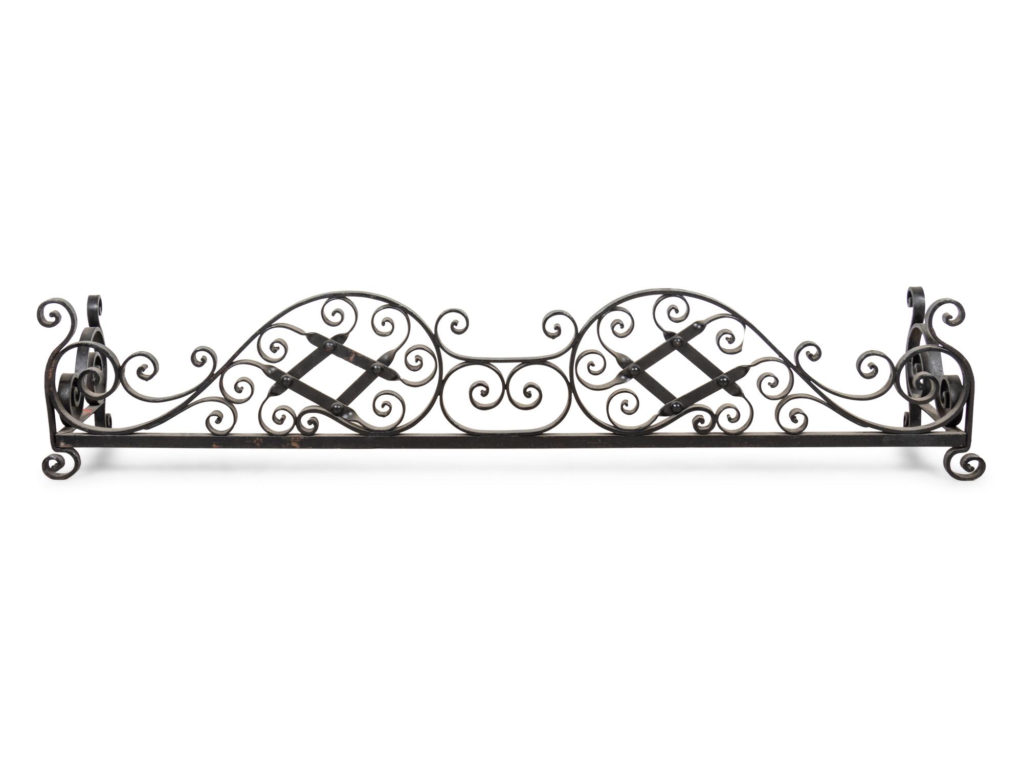 A Wrought Iron Fireplace Fender