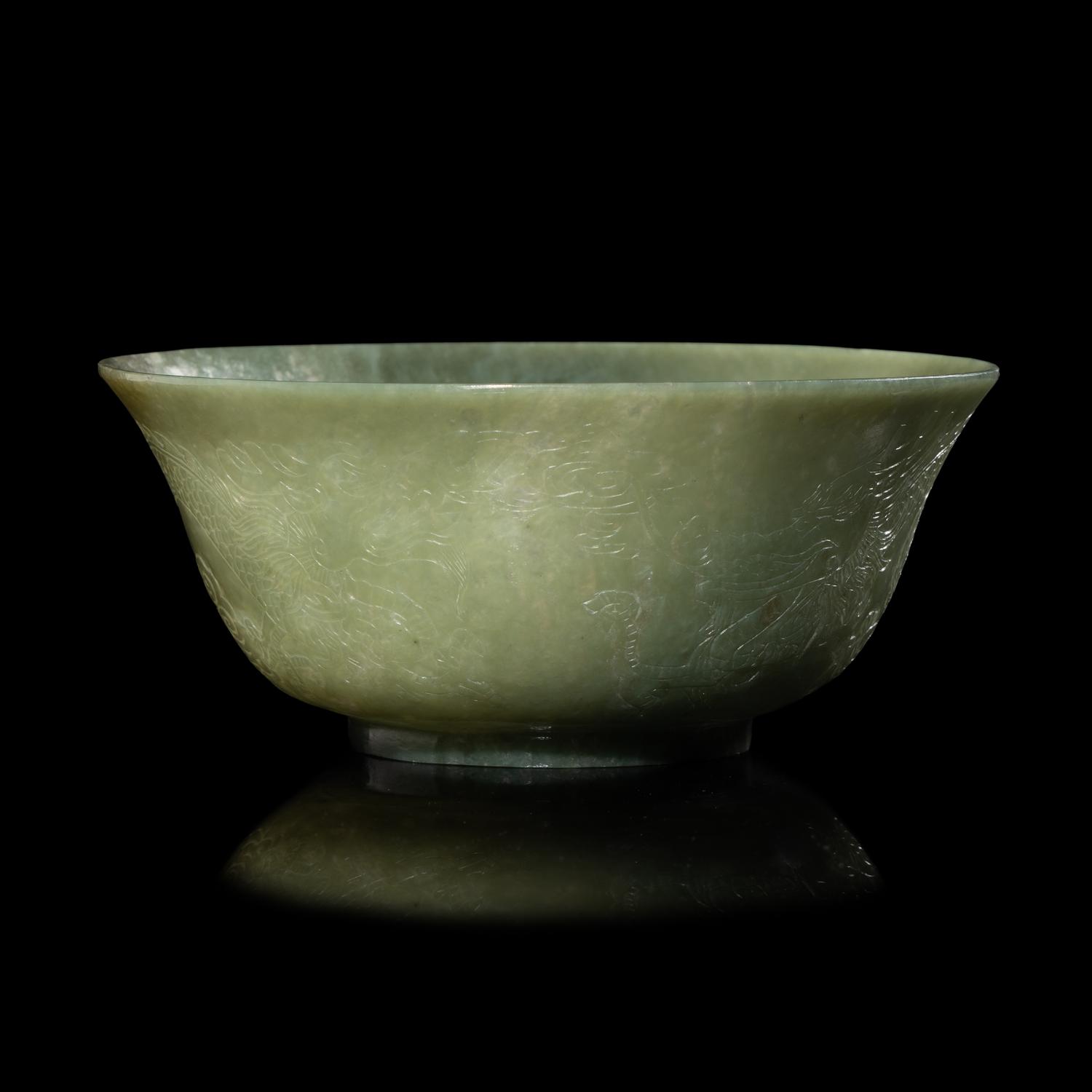 A Chinese Celadon Jade 'Dragon' Bowl, 20th Century 近代 青玉刻龍紋碗