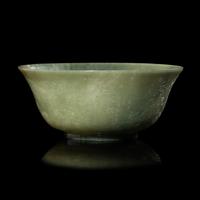 A Chinese Celadon Jade 'Dragon' Bowl, 20th Century 近代 青玉刻龍紋碗