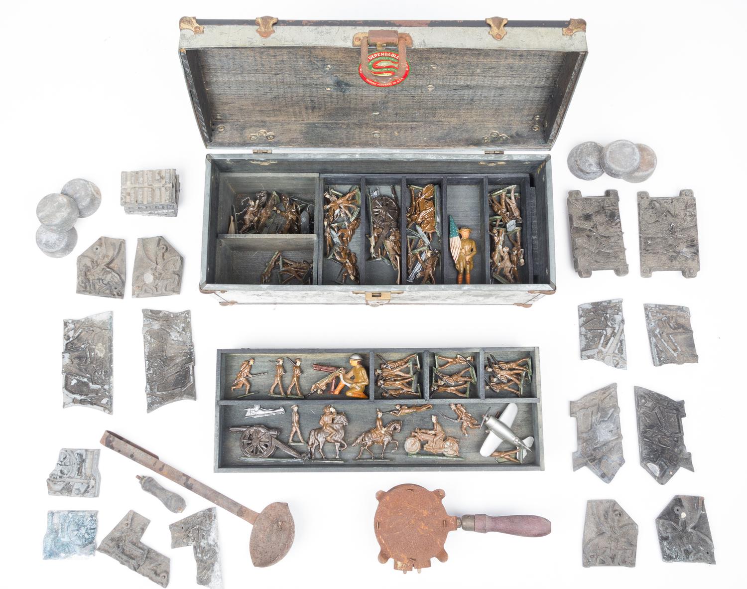 A Collection of Cast Metal Army Men Width of box 16 inches.