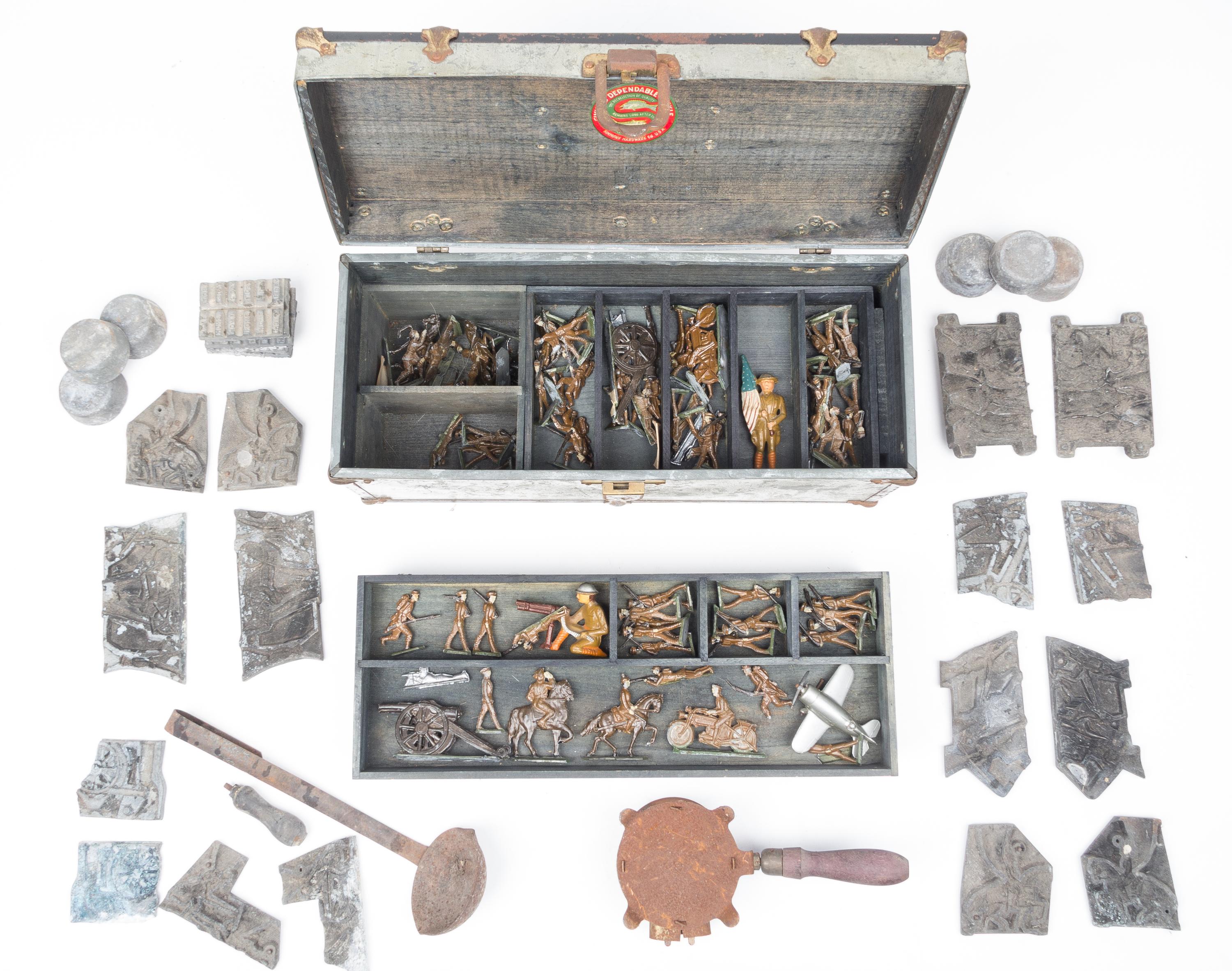 A Collection of Cast Metal Army Men Width of box 16 inches.