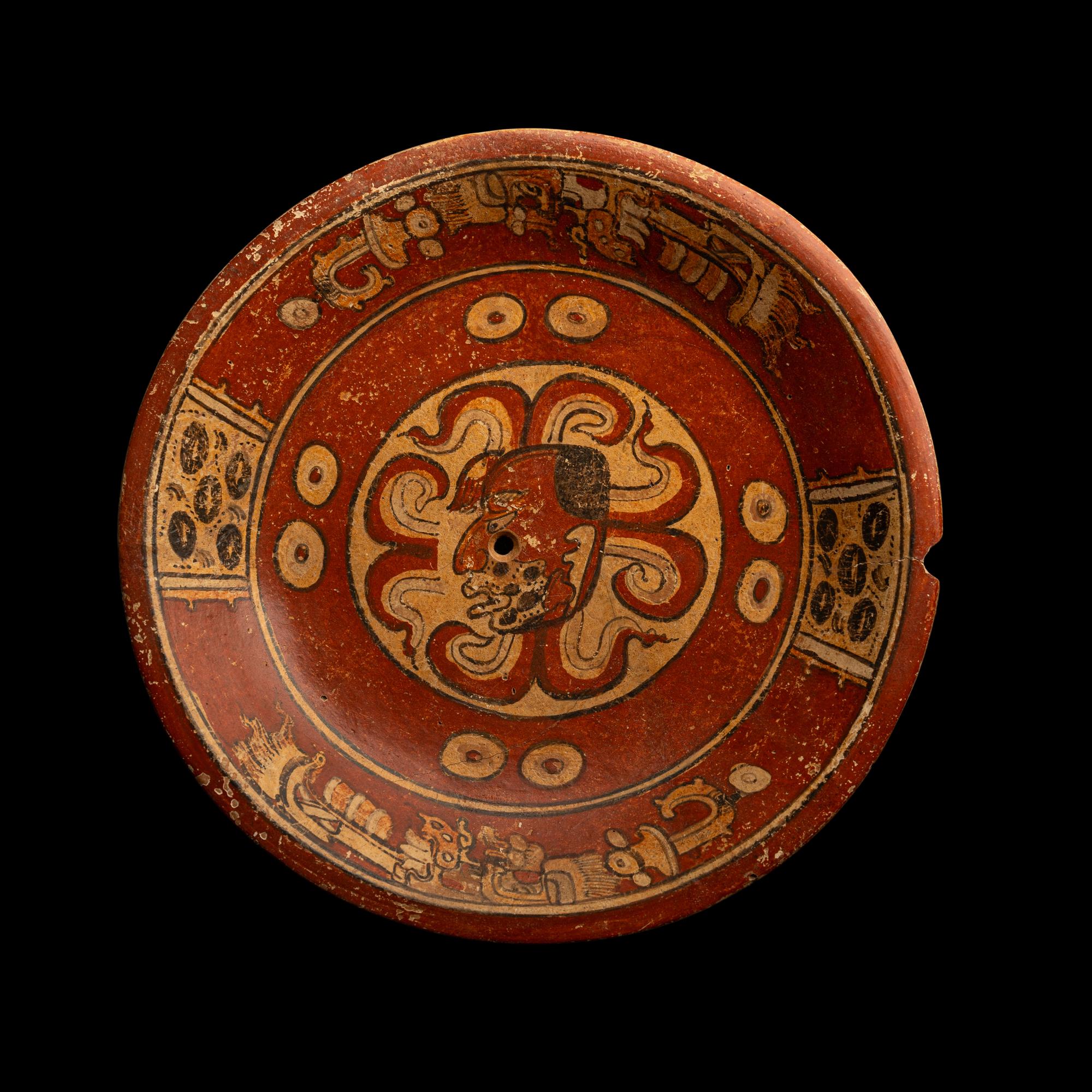 A Maya Polychrome Terracotta Tripod Plate with Gods and Glyphs