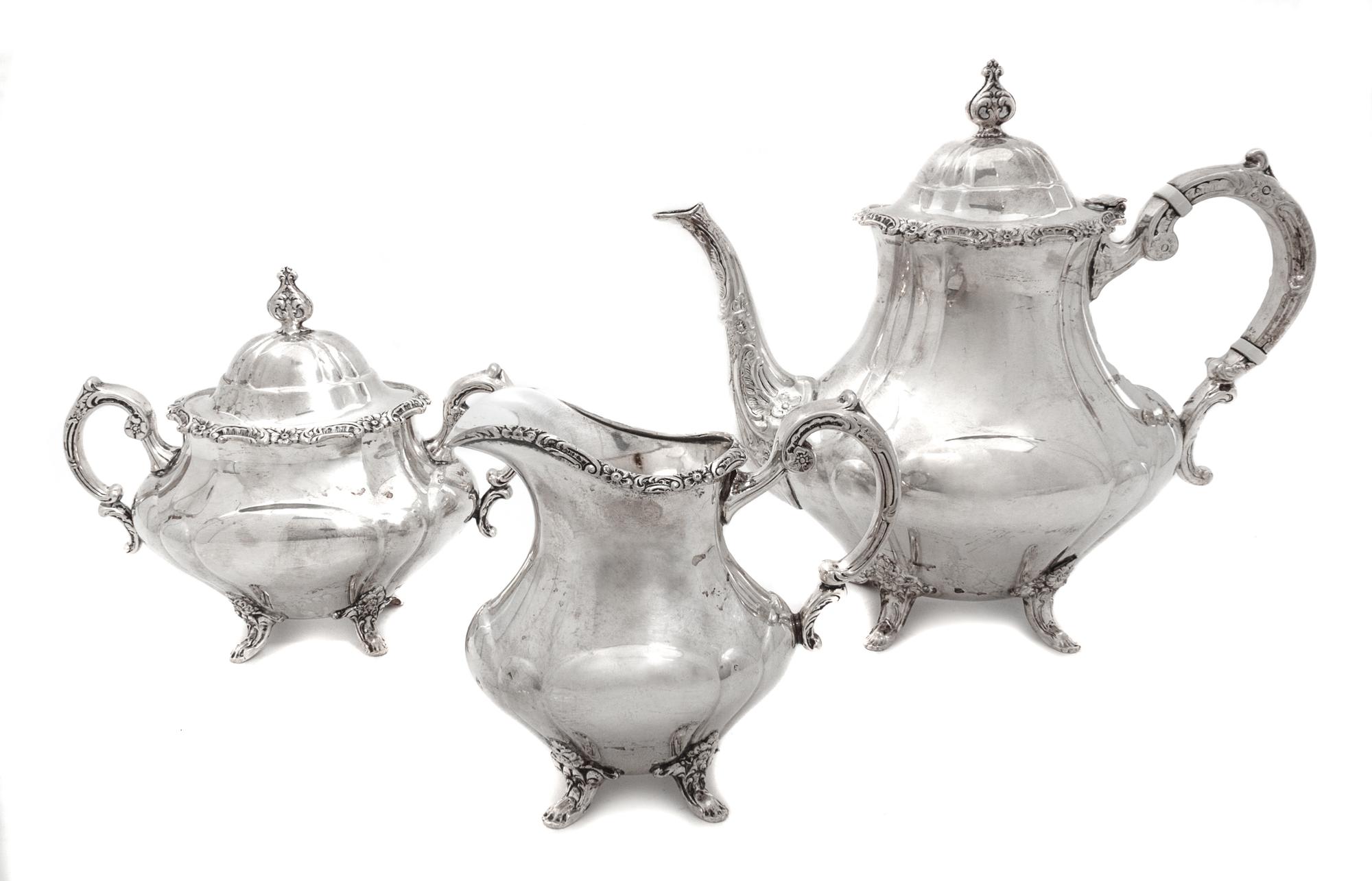 An American Silver Three-Piece Coffee Service, Reed & Barton, Taunton, MA, comprising a coffee pot, a creamer and a covered sugar.