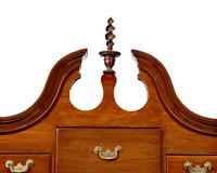 A Queen Anne Carved Walnut Bonnet-Top High Chest of Drawers