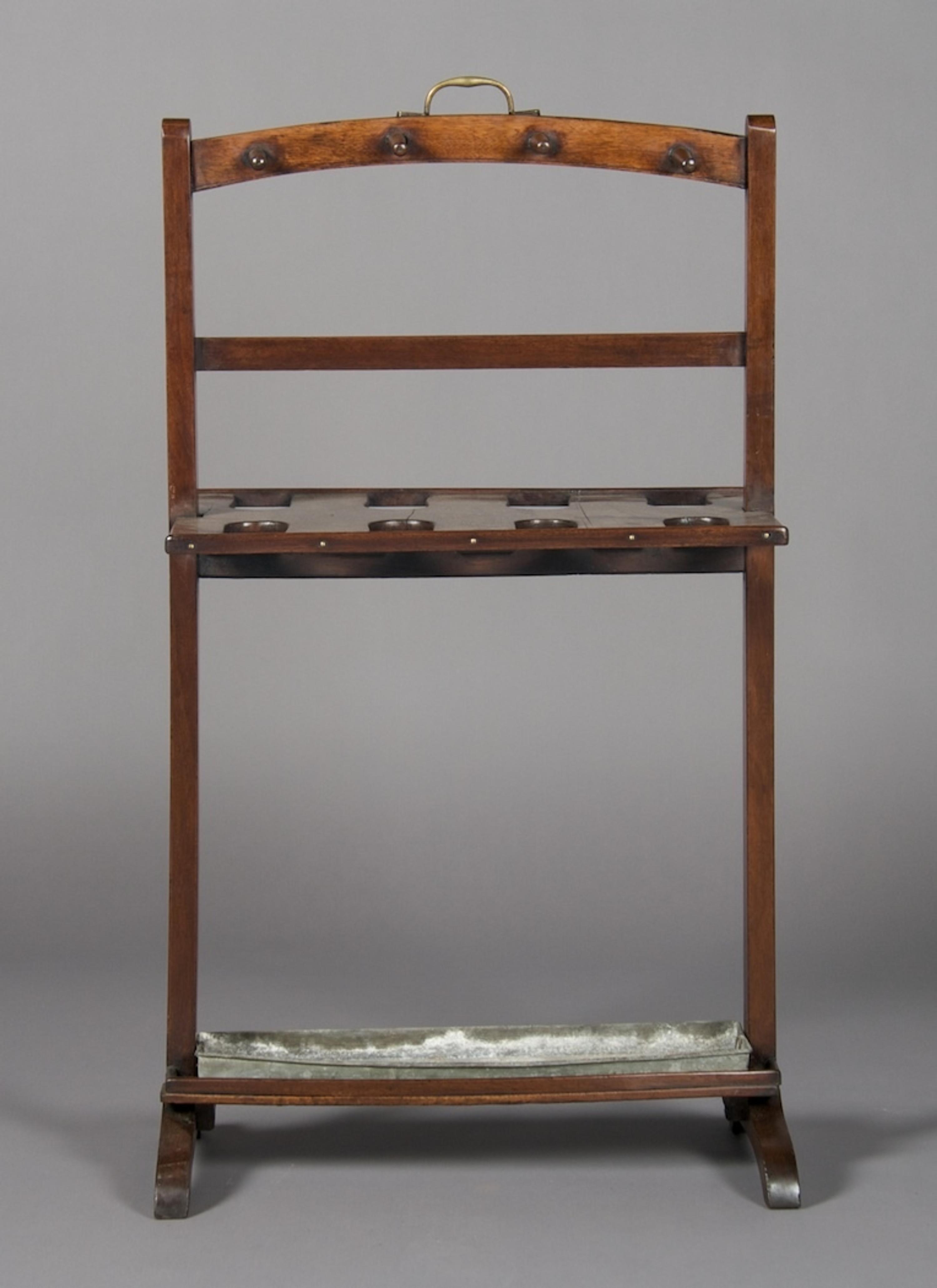 An English Mahogany Boot Jack, Height 37 inches.