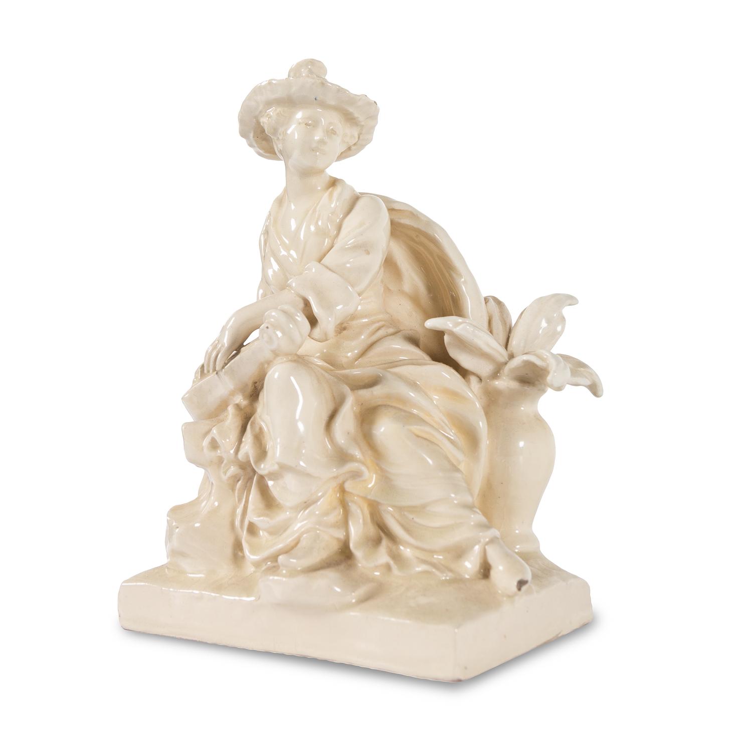 A French White Glazed Faience Chinoiserie Figure