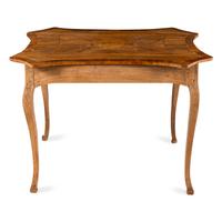 An Italian Walnut and Fruitwood Center Table