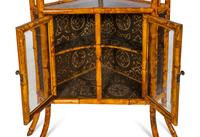 An Edwardian Chinoiserie Decorated Bamboo Corner Cabinet