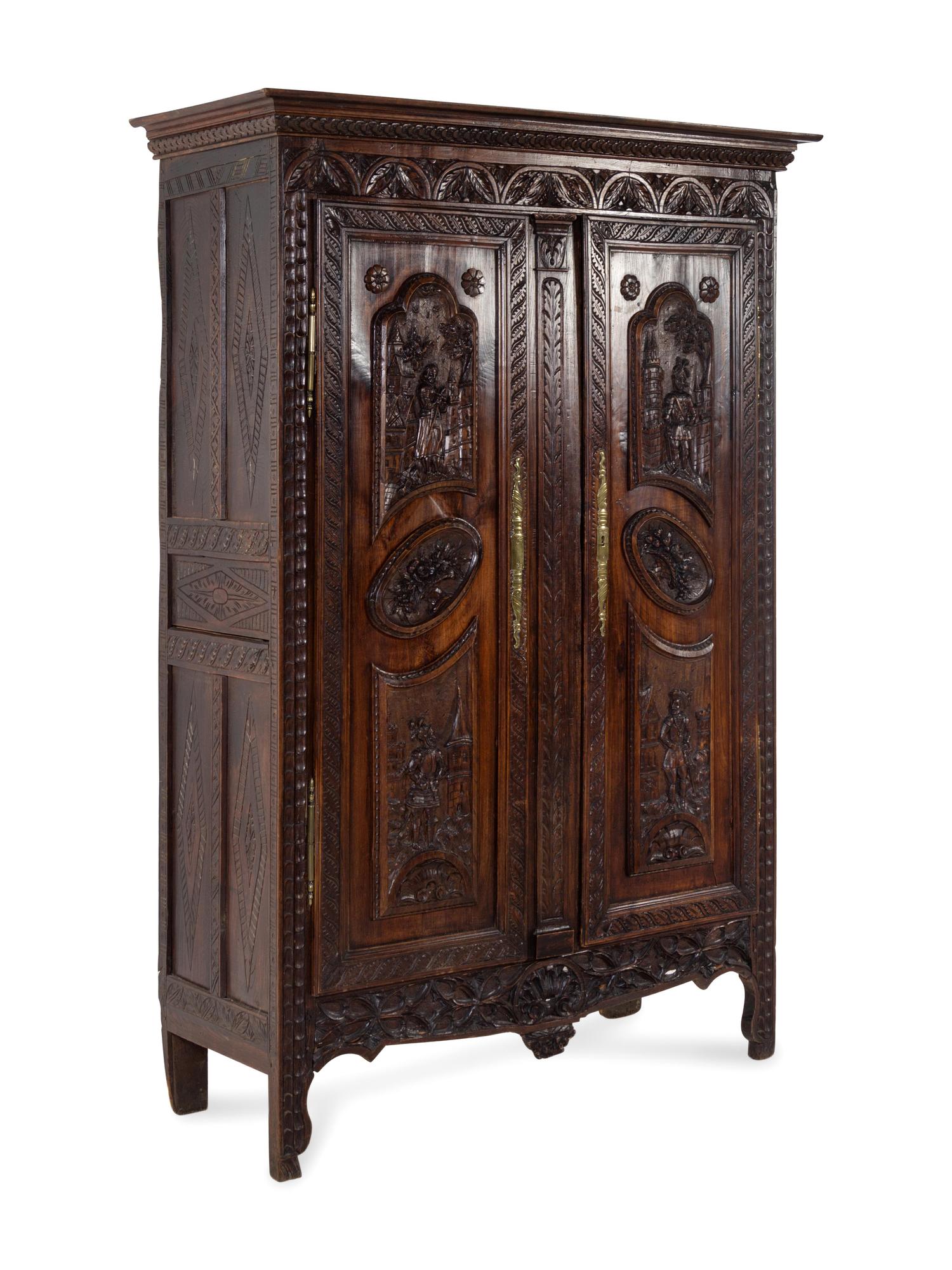 A Brittany Style Carved Oak Armoire