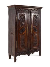 A Brittany Style Carved Oak Armoire