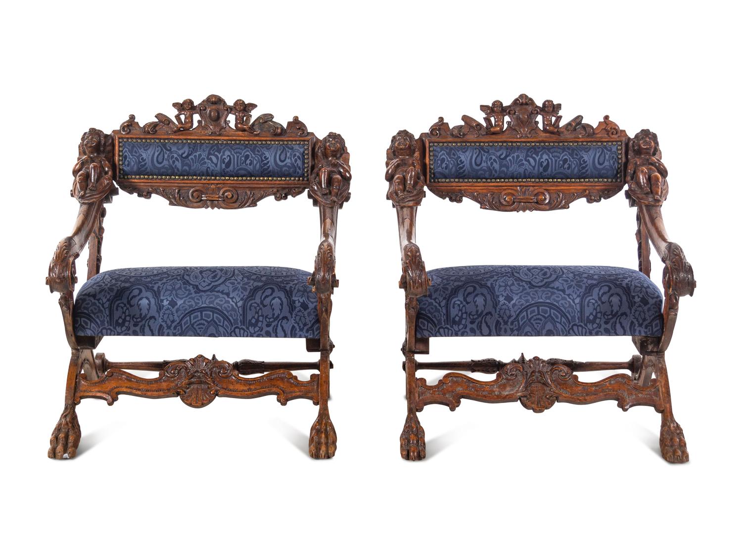 A Pair of Italian Renaissance Style Carved Walnut Armchairs