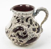 An American Silver Mounted Glass Water Pitcher, Whiting Mfg. Co., New York, NY, the silver liner worked with openwork floral, foliate a