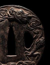 Two Japanese Cast Iron Tsuba