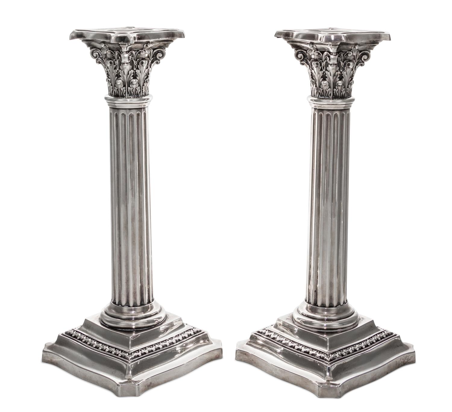 A Pair of American Silver Candlesticks, R. Wallace & Sons Mfg. Co., Wallington, CT, in the form of Corinthian columns raised on foliate