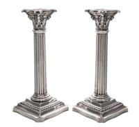 A Pair of American Silver Candlesticks, R. Wallace & Sons Mfg. Co., Wallington, CT, in the form of Corinthian columns raised on foliate
