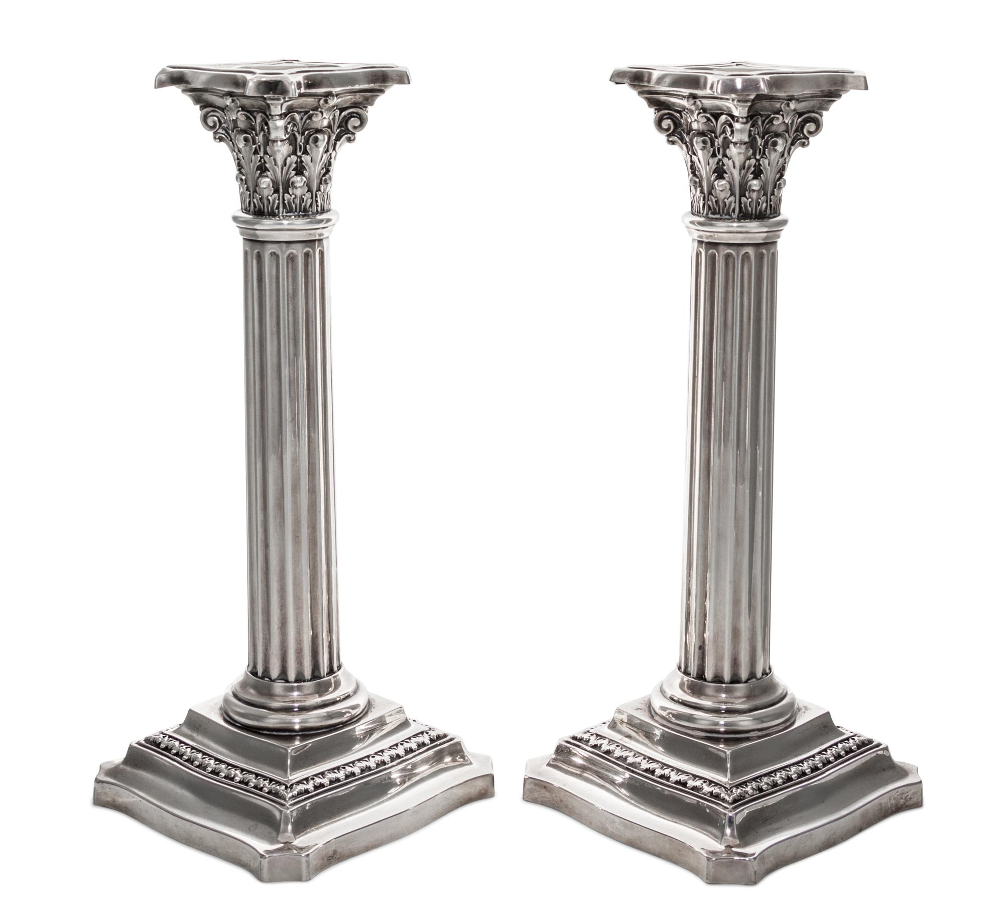 A Pair of American Silver Candlesticks, R. Wallace & Sons Mfg. Co., Wallington, CT, in the form of Corinthian columns raised on foliate