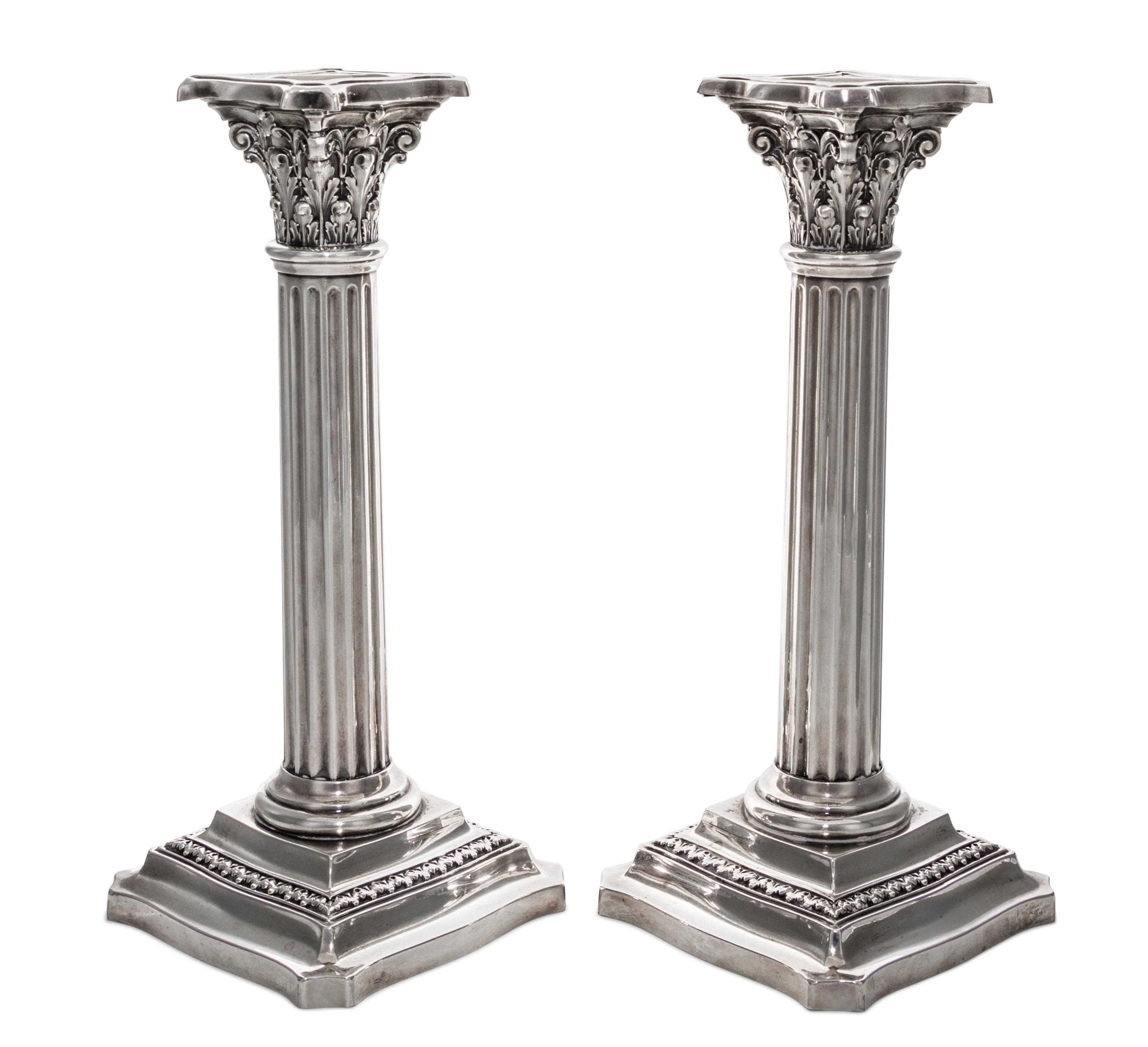 A Pair of American Silver Candlesticks, R. Wallace & Sons Mfg. Co., Wallington, CT, in the form of Corinthian columns raised on foliate