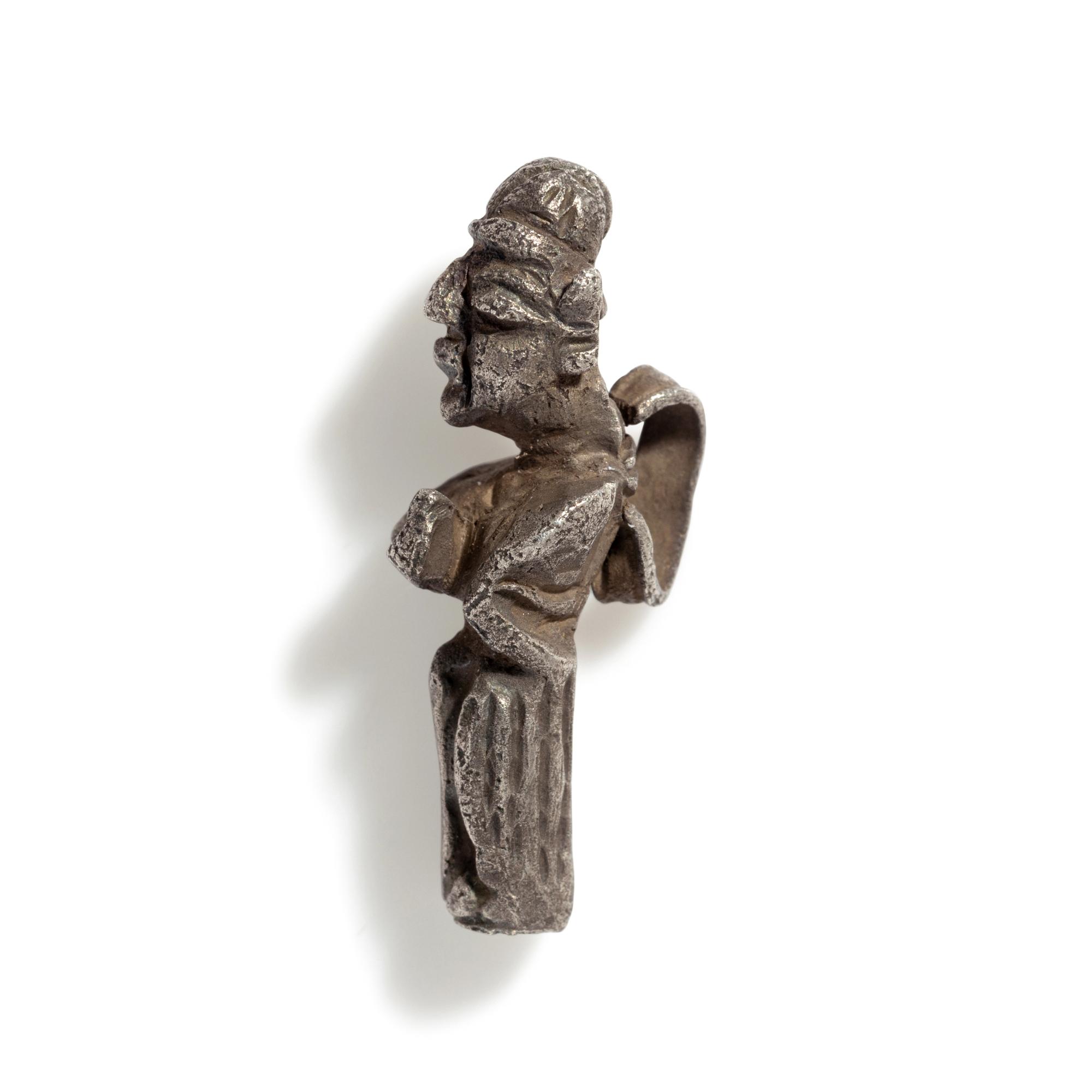 A Phoenician Silver Pendant of a Deity