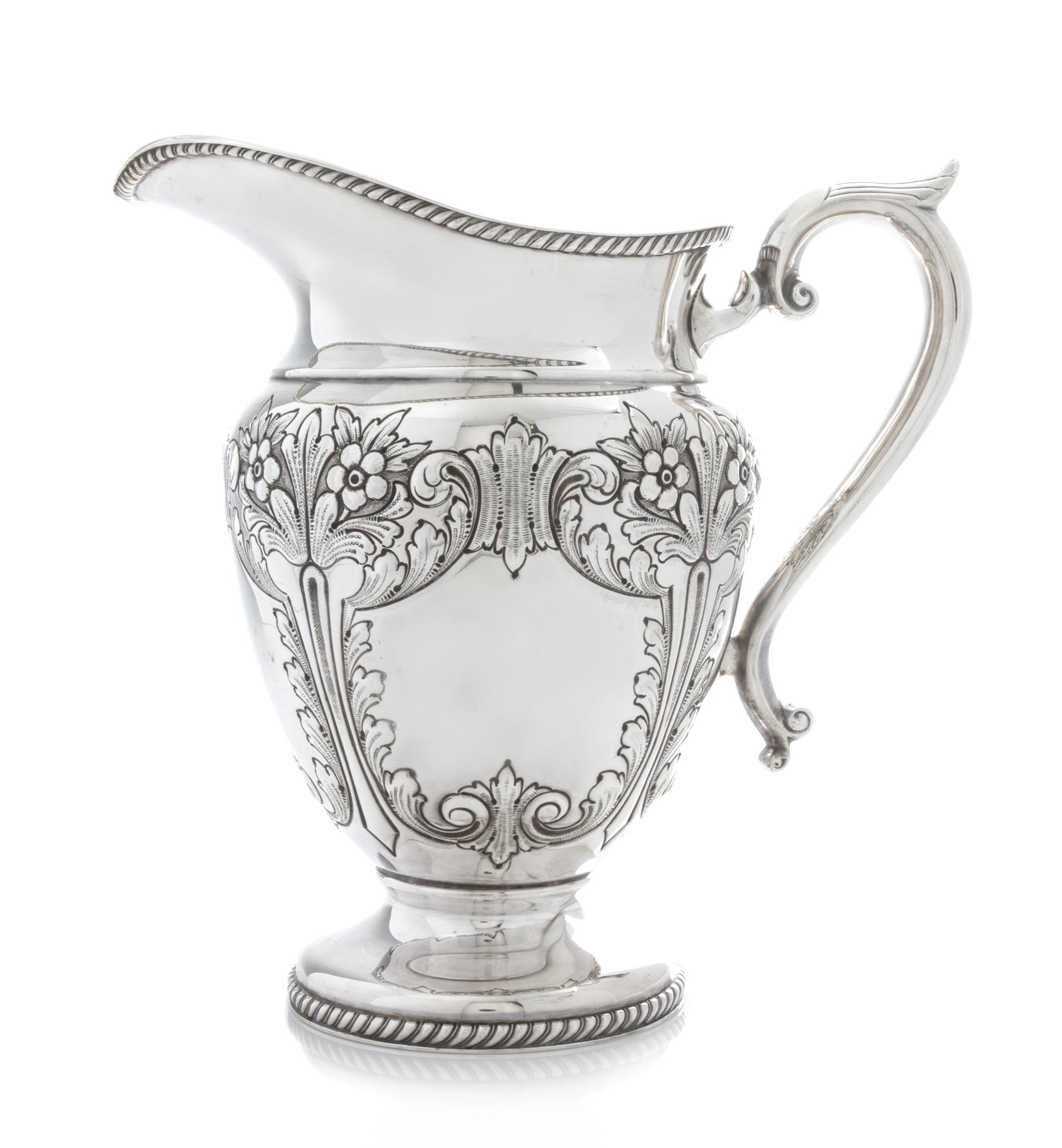 An American Silver Water Pitcher, Durham Silver Co., New York, NY, Mid-20th Century, of baluster form with a gadroon neck and foot rim,