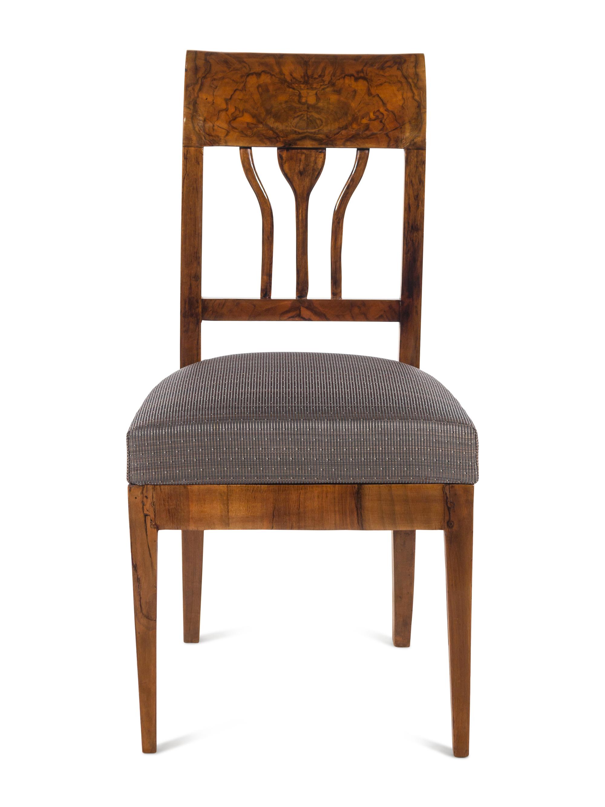 An Austrian Neoclassical Burlwood Writing Table and Chair