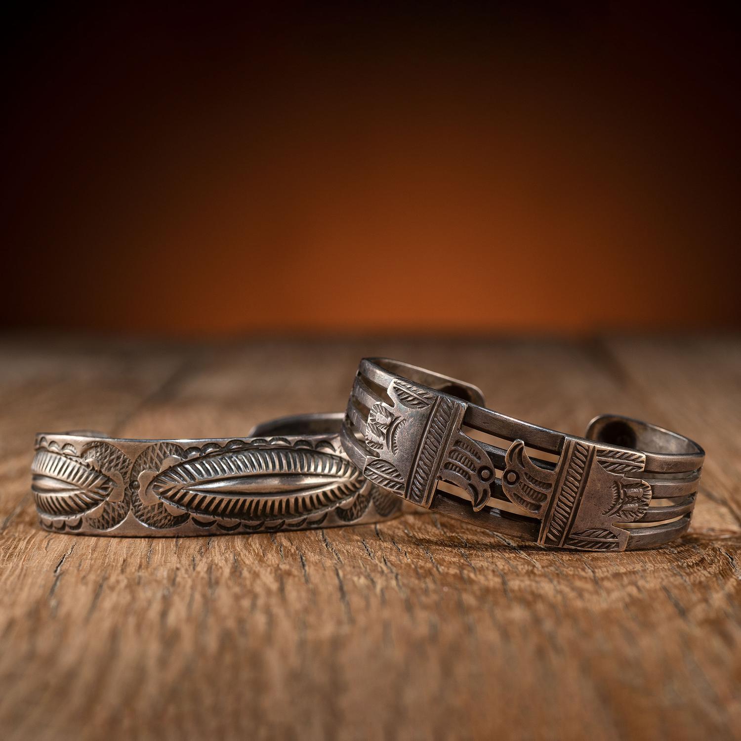 Pair of Navajo Silver Cuff Bracelets, with Thunderbirds