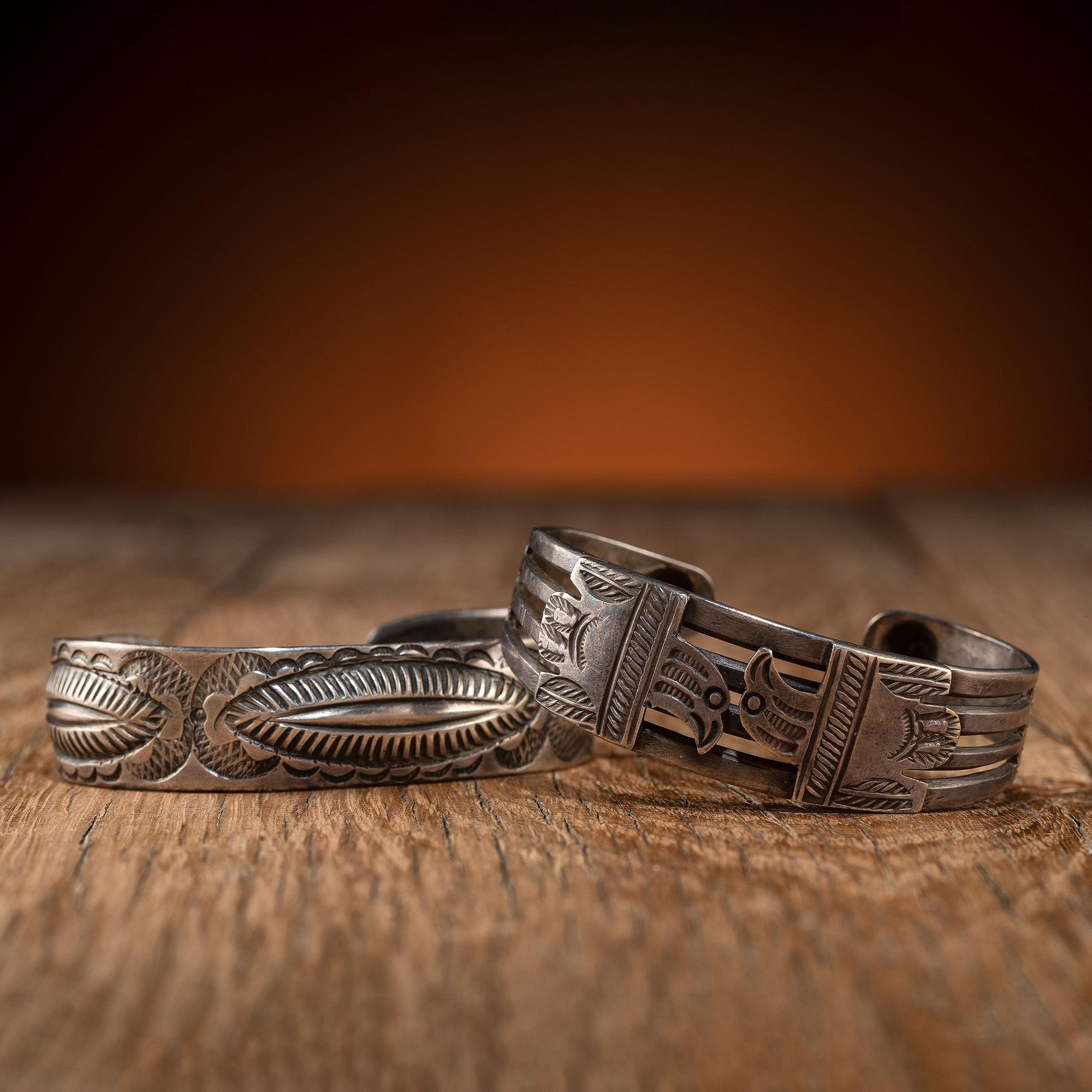 Pair of Navajo Silver Cuff Bracelets, with Thunderbirds