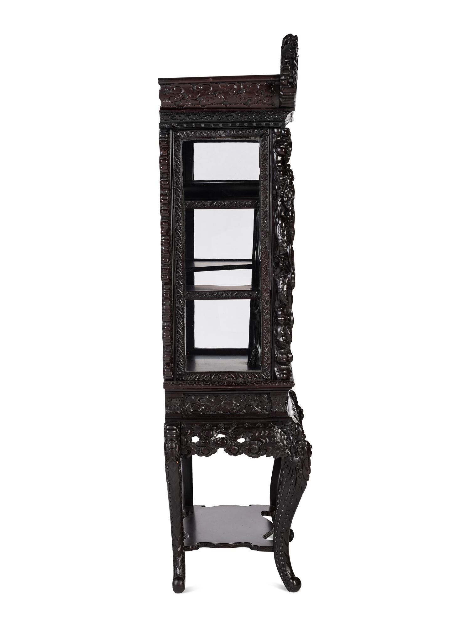 A Japanese Carved Hardwood Display Cabinet