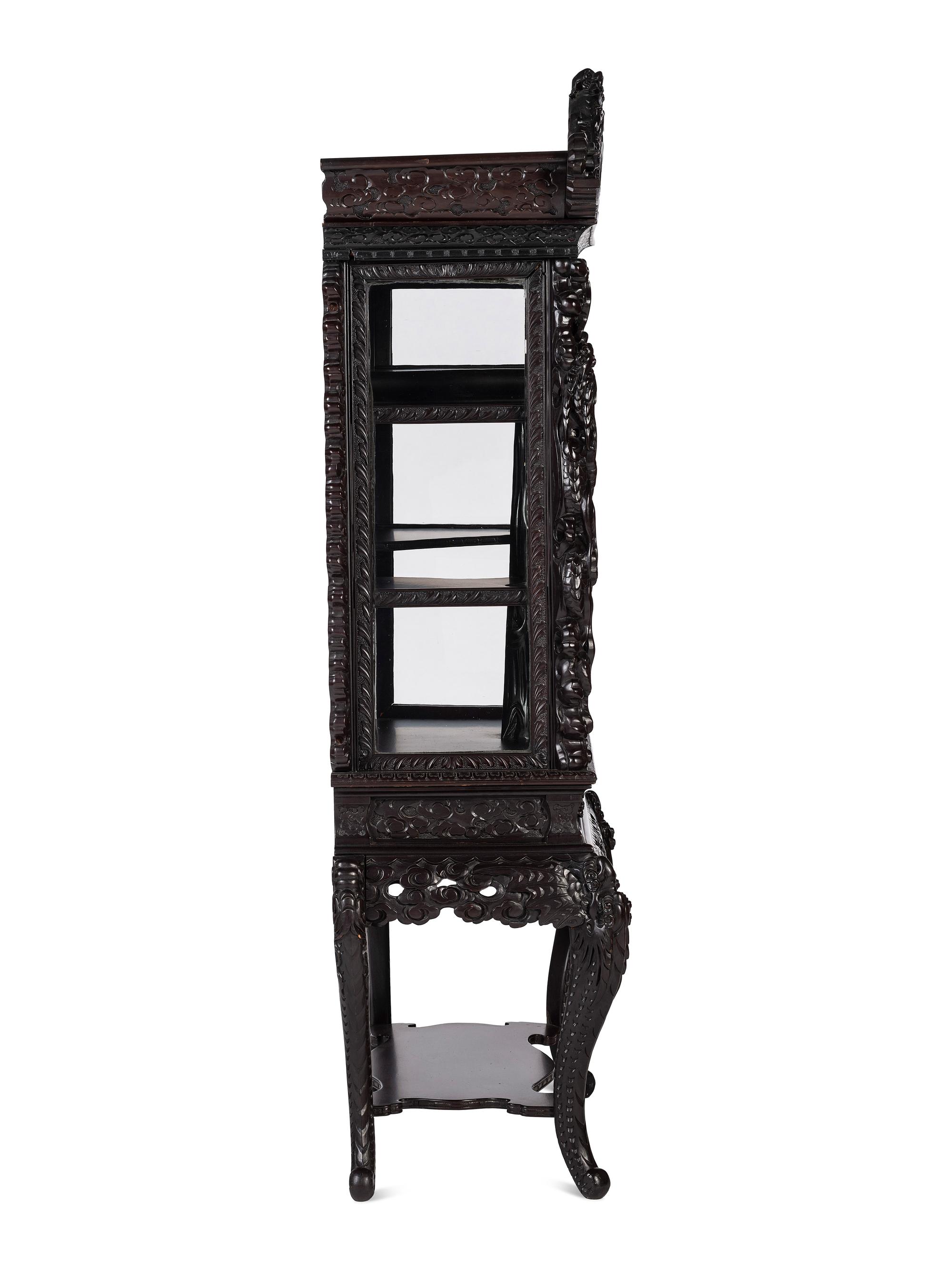 A Japanese Carved Hardwood Display Cabinet