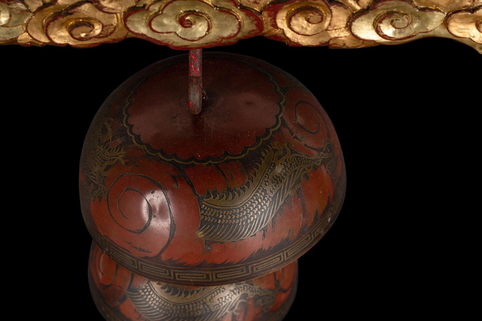 A Set of Gongs with Matching Carved Gilt and Red Lacquered Wood Stand