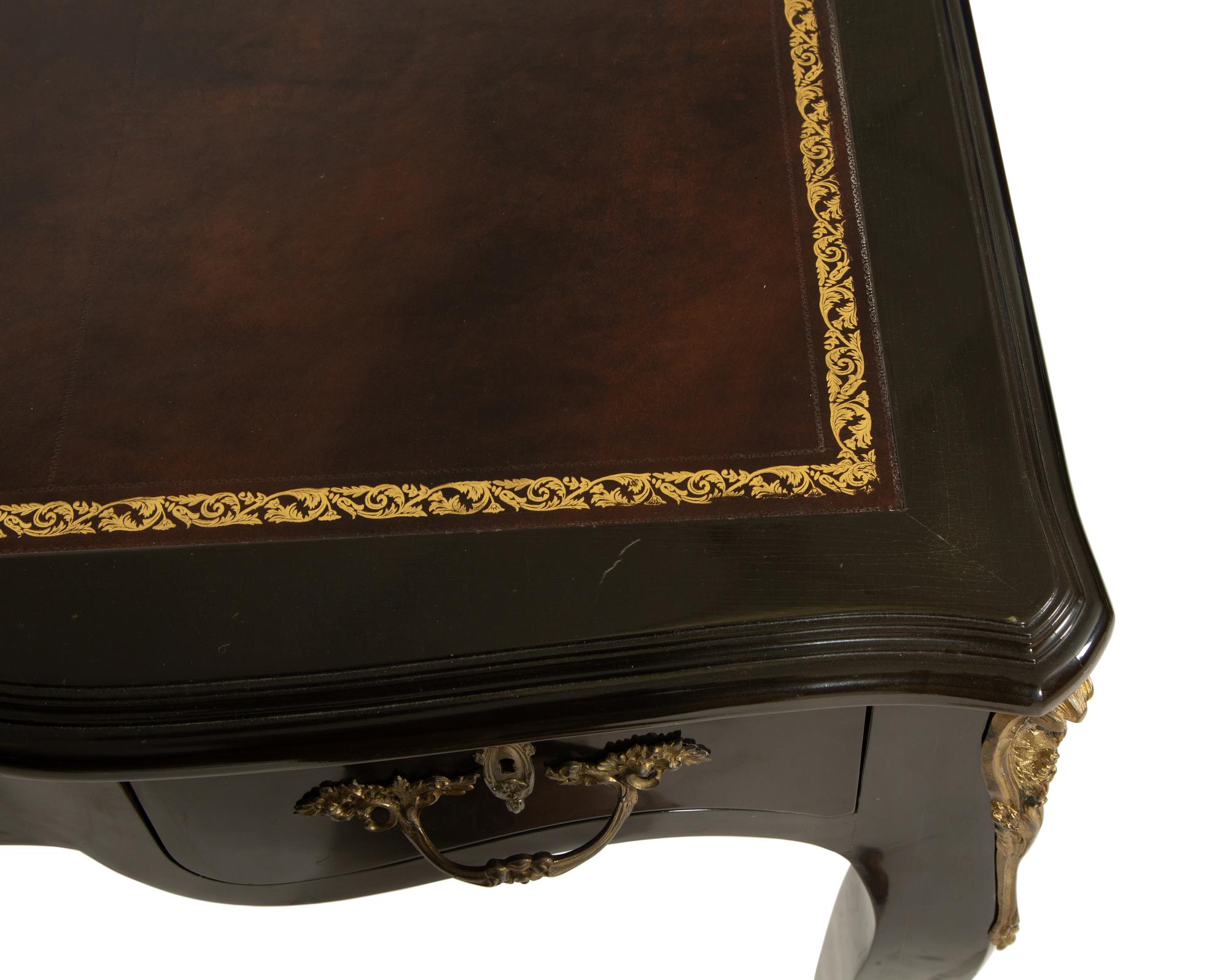 A Louis XV Style Gilt Metal-Mounted Ebonized Bureau Plat