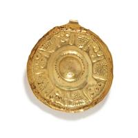 A Near Eastern Gold Disk Pendant