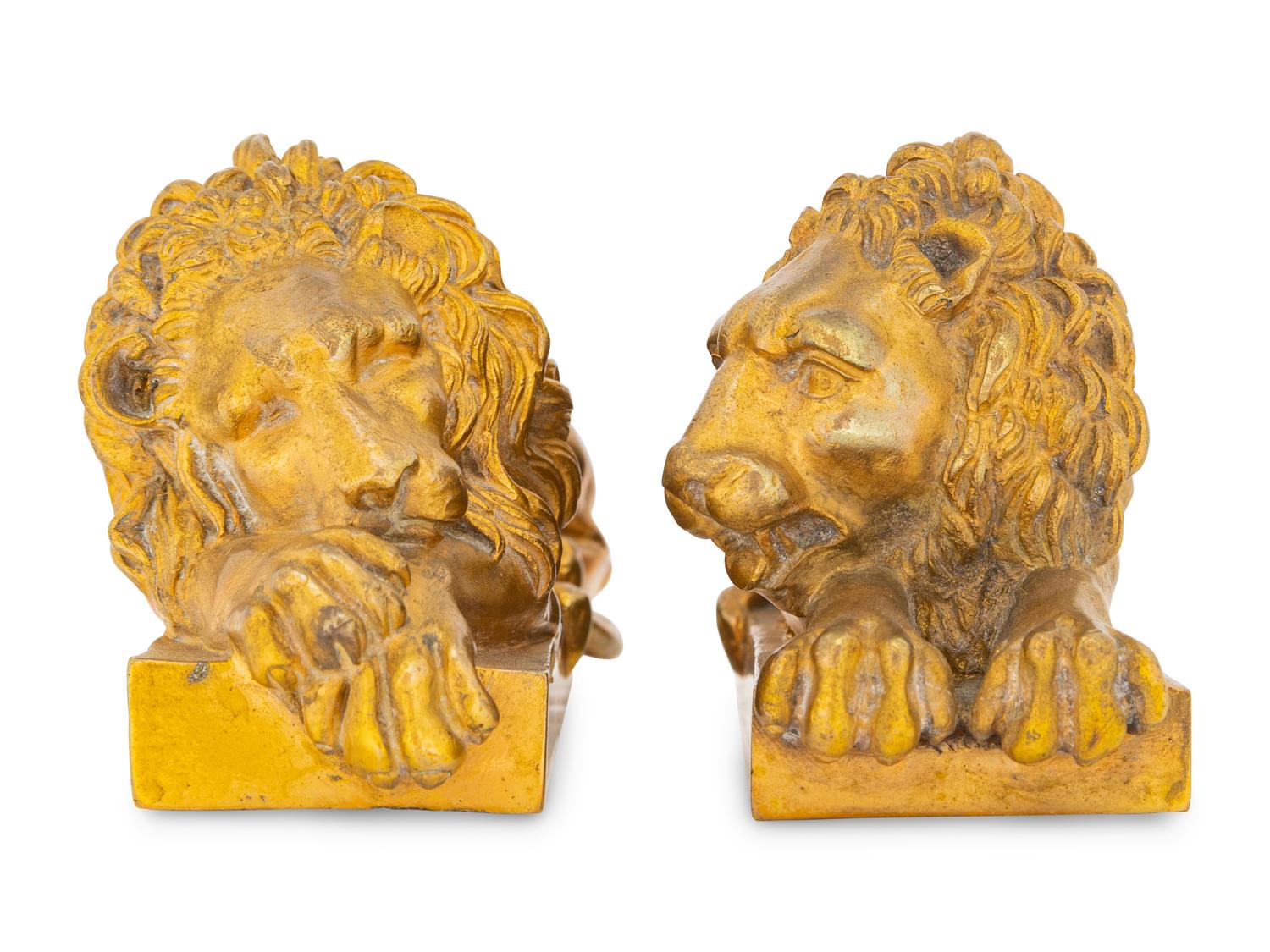 A Pair of Continental Bronze Recumbent Lions