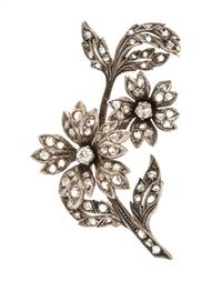 A Silver Topped Gold and Diamond Flower Brooch, 8.70 dwts.