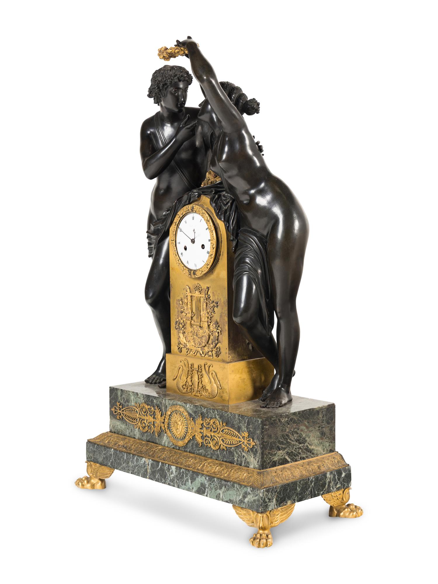 A French Parcel Gilt and Patinated Bronze Figural Mantel Clock