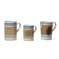 A Group of Three Large Mochaware Mugs with "Seaweed Decoration"