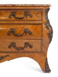 A Pair of Régence Style Bronze Mounted Marble-Top Commodes