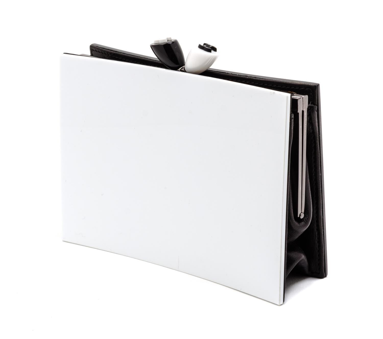A Chanel Black and White Resin Clutch, 6 1/2 x 5 x 2 inches.